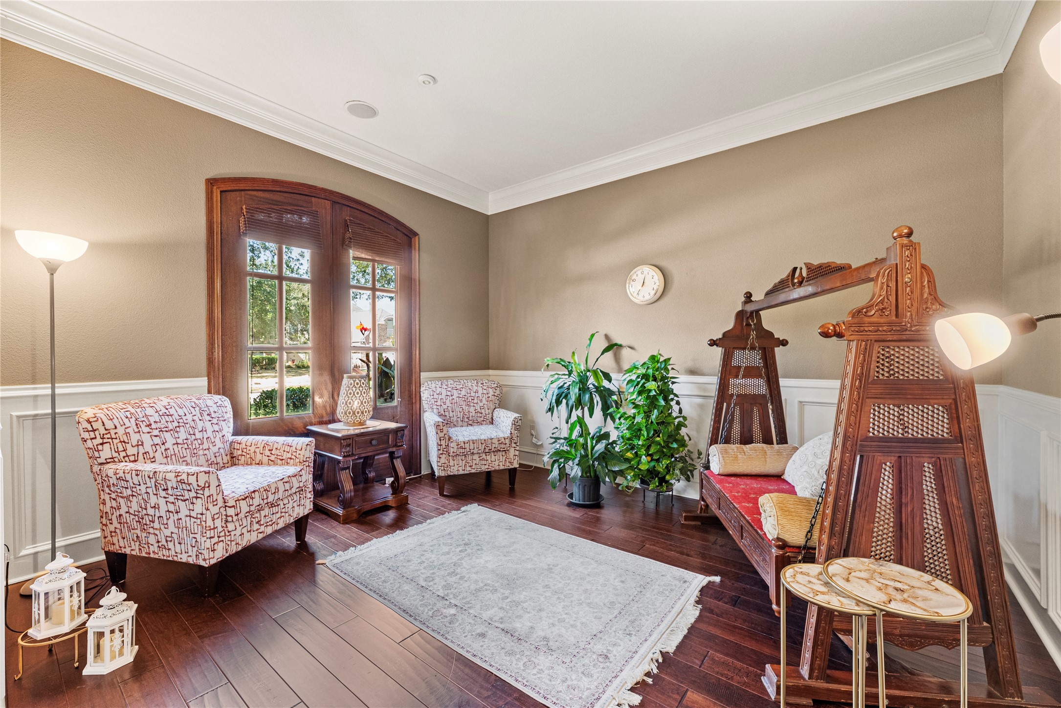 3550 Windrose Drive Beaumont, TX 77706 - Photo 14 of 50 Charming front sitting room accented with wainscoting, crown molding, and warm wood trim. A perfect space for reading, conversation, or quiet reflection.