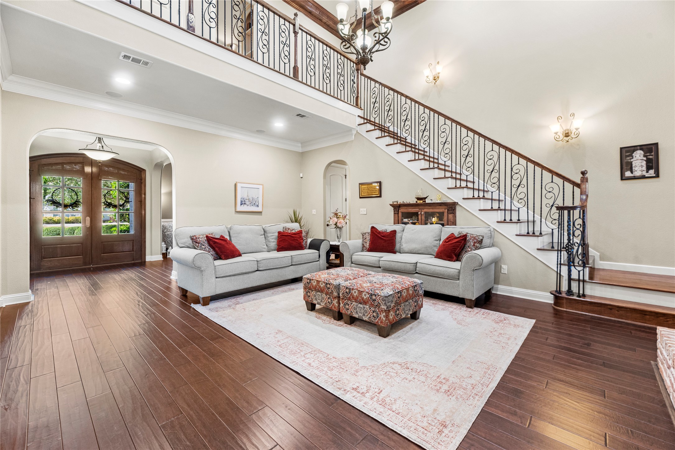 3550 Windrose Drive Beaumont, TX 77706 - Photo 18 of 50 Spacious and open layout highlighted by the front double doors and sweeping staircase. The hand-scraped flooring continues throughout for a cohesive, upscale look.