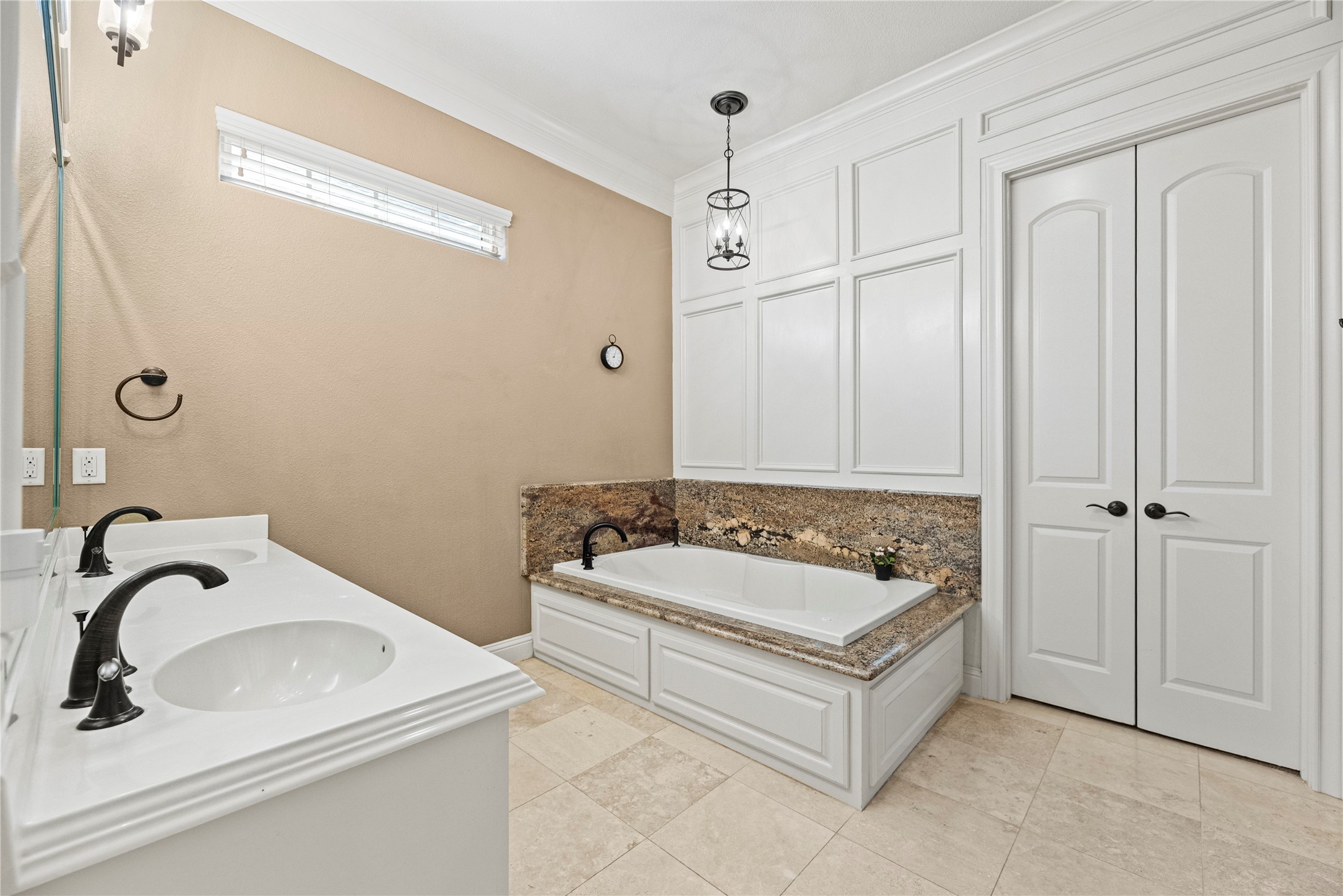3550 Windrose Drive Beaumont, TX 77706 - Photo 28 of 50 Elegant and spacious bath with double-door closet access, designer light fixtures, and rich granite accents that echo the home’s refined craftsmanship.