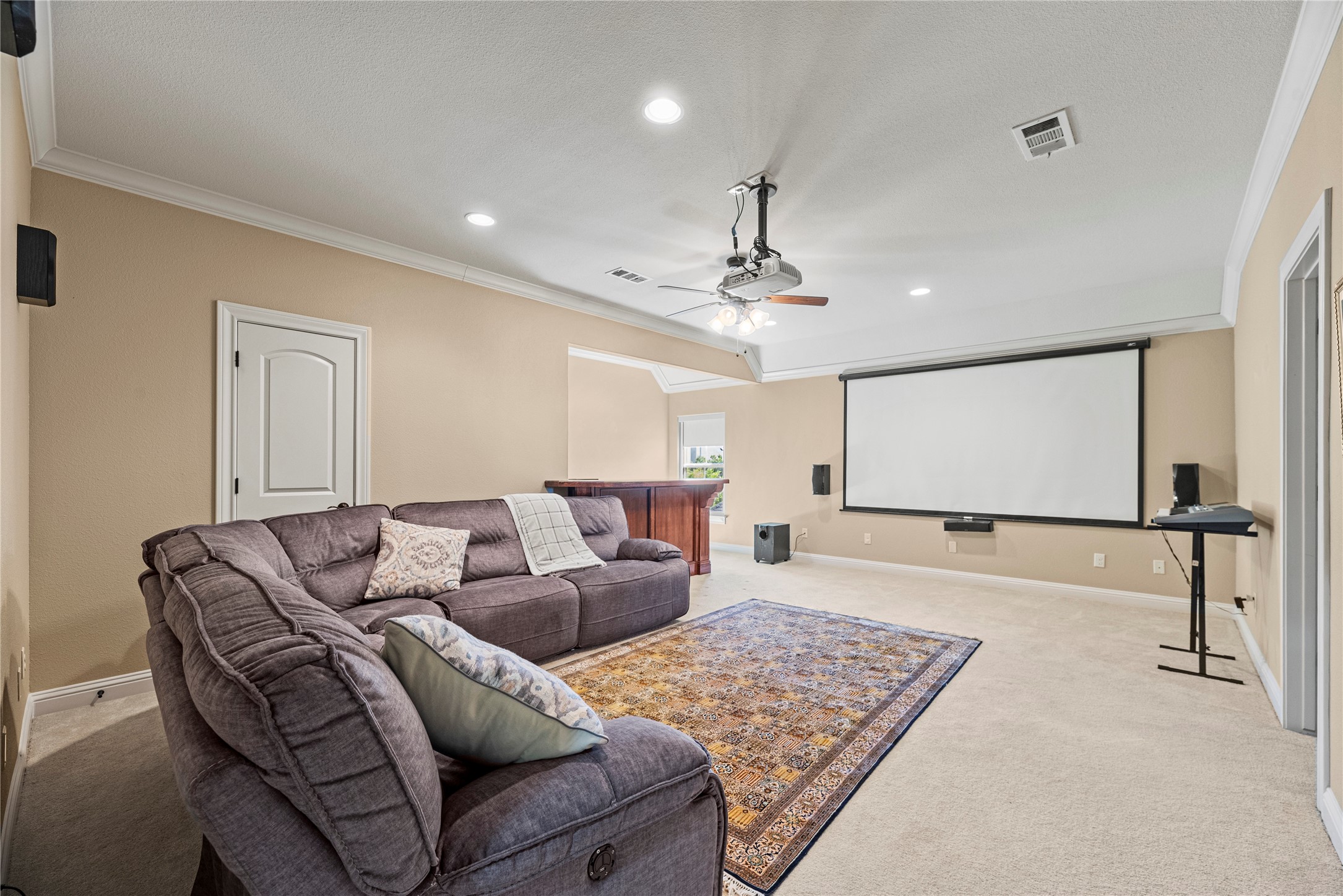 3550 Windrose Drive Beaumont, TX 77706 - Photo 37 of 50 Expansive upstairs media room complete with projector, screen, surround-sound wiring, and bar area. The adjoining nook is perfect for entertaining, with convenient access to a full bath shared with the adjacent bedroom.