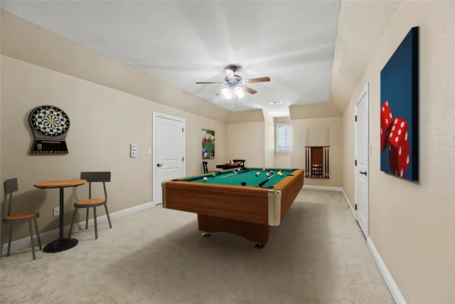 a room with a table chairs and a window