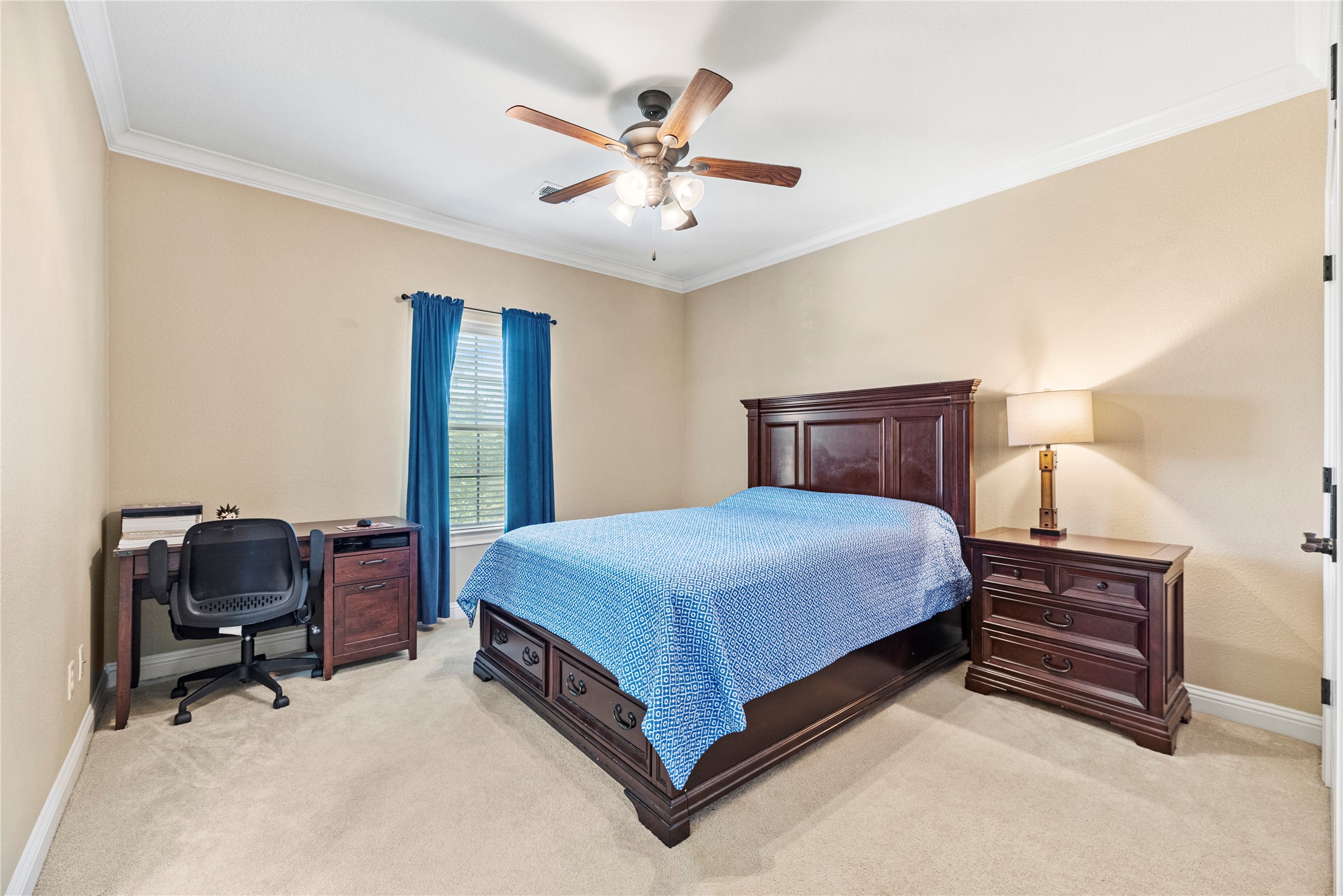3550 Windrose Drive Beaumont, TX 77706 - Photo 40 of 50 Spacious upstairs bedroom featuring crown molding, plush carpet, and generous closet space — connected to the Jack & Jill bath for added convenience.
