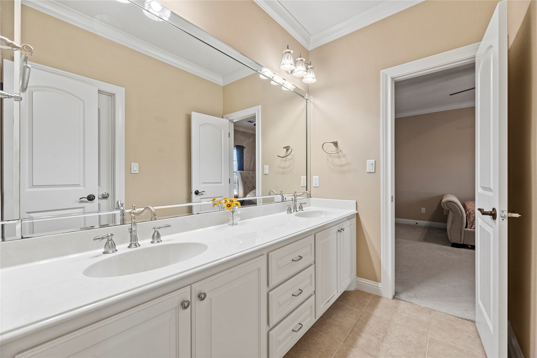 3550 Windrose Drive Beaumont, TX 77706 - Photo 41 of 50 Full Jack & Jill bath with dual sinks, elegant lighting, and ample cabinetry — shared between two secondary bedrooms.