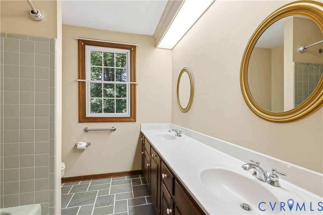 2725 Queenswood Road Midlothian, VA 23113 - Photo 14 of 17 Tile flooring and tile surround bathtub. Double va