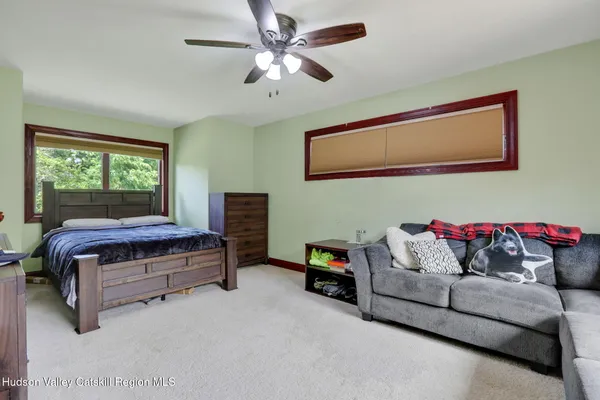 a living room with furniture and a window