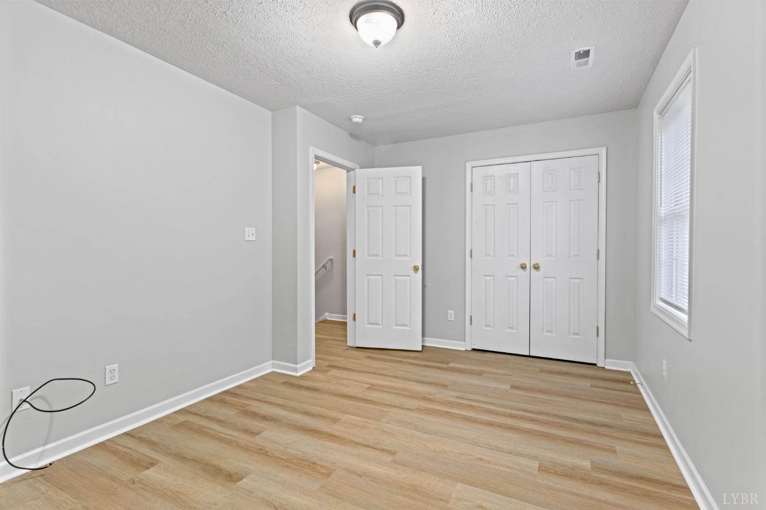 1083 Blane Drive Forest, VA 24551 - Photo 14 of 19 a view of a livingroom with wooden floor