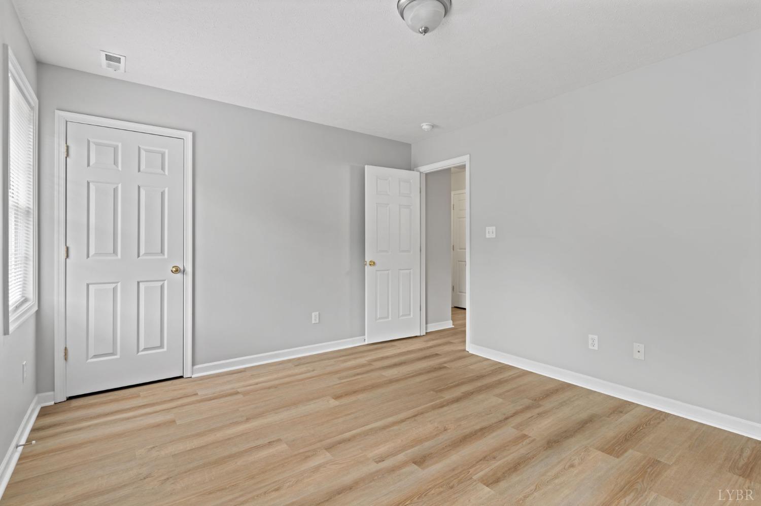 1083 Blane Drive Forest, VA 24551 - Photo 17 of 19 a view of an empty room with wooden floor