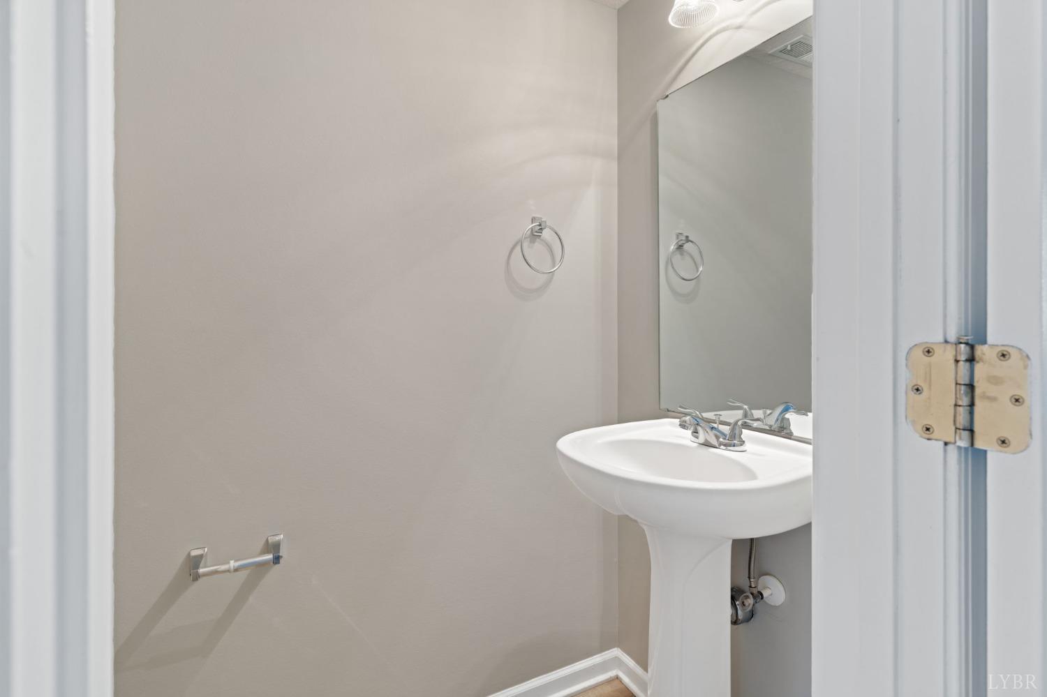 1083 Blane Drive Forest, VA 24551 - Photo 7 of 19 a bathroom with a sink a mirror and shower