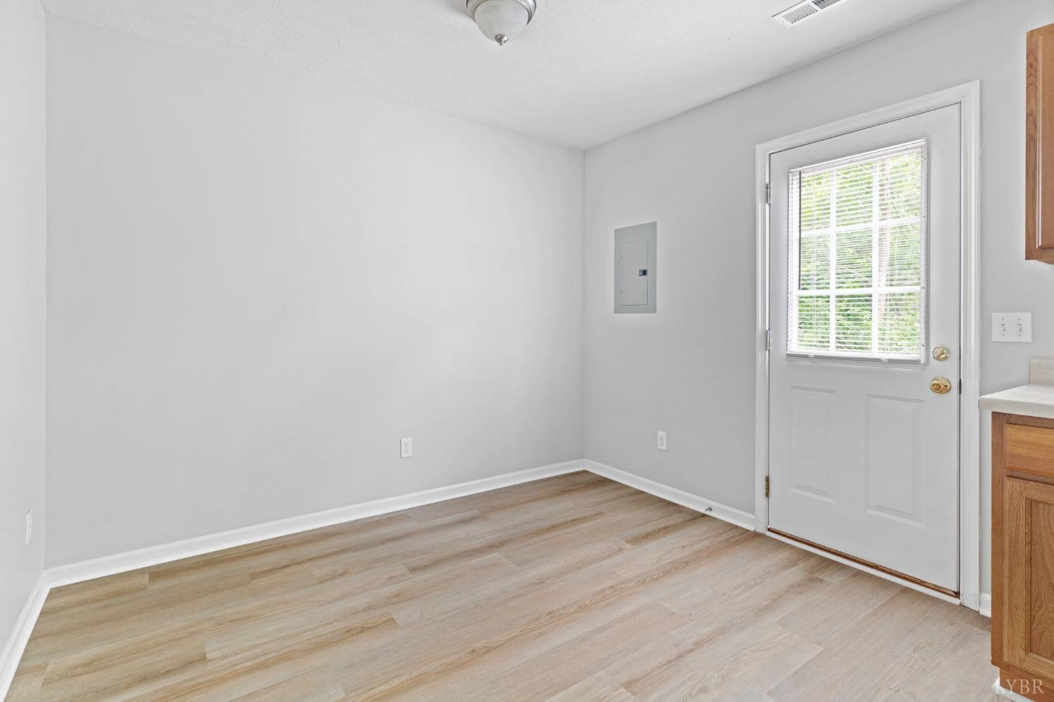 1083 Blane Drive Forest, VA 24551 - Photo 8 of 19 an empty room with wooden floor and windows