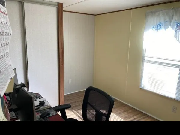 a view of chair and glass door