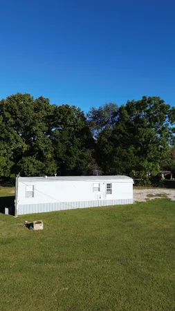 a view of a green field with clear sky