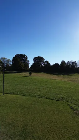 a view of a lake and a yard