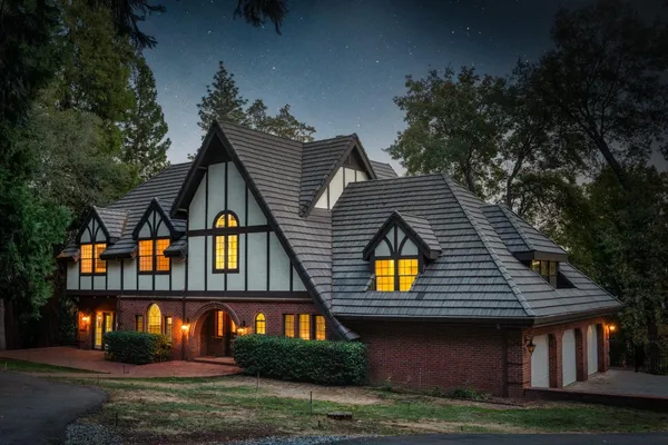 a front view of a house with a yard