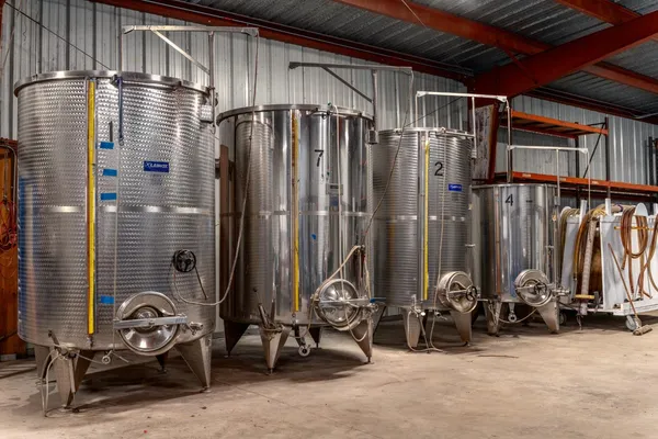 a view of a brick house with a large windows and a small yard