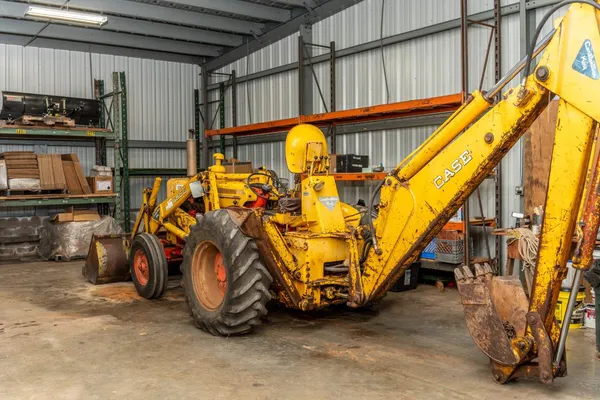 a kitchen with stainless steel appliances granite countertop a refrigerator a sink and a stove