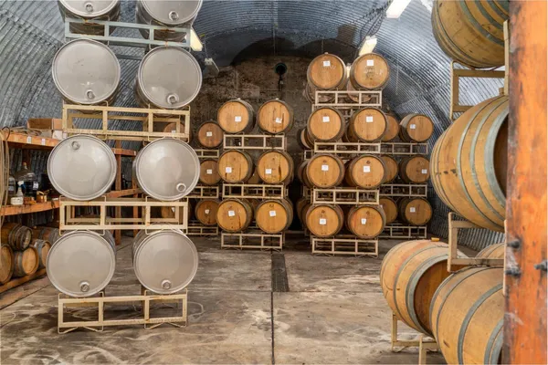 a spacious bedroom with a bed and glass window