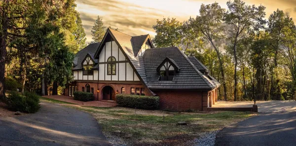 an aerial view of a house with a lake view