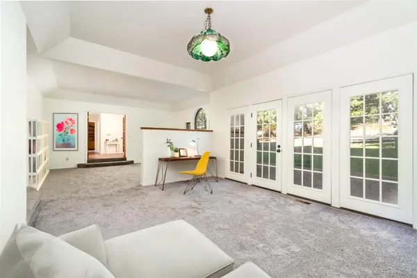 a bedroom with a bed and a table