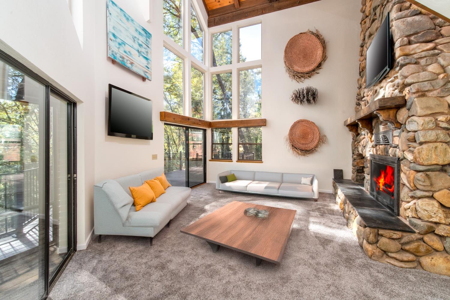 3961 7 Ridges Road Camino, CA 95709 - Photo 44 of 93 an outdoor living room with furniture and a floor to ceiling window