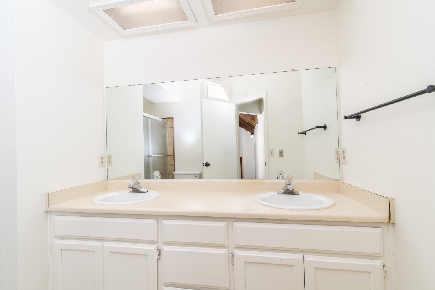 3961 7 Ridges Road Camino, CA 95709 - Photo 70 of 93 a bathroom with a sink and a mirror