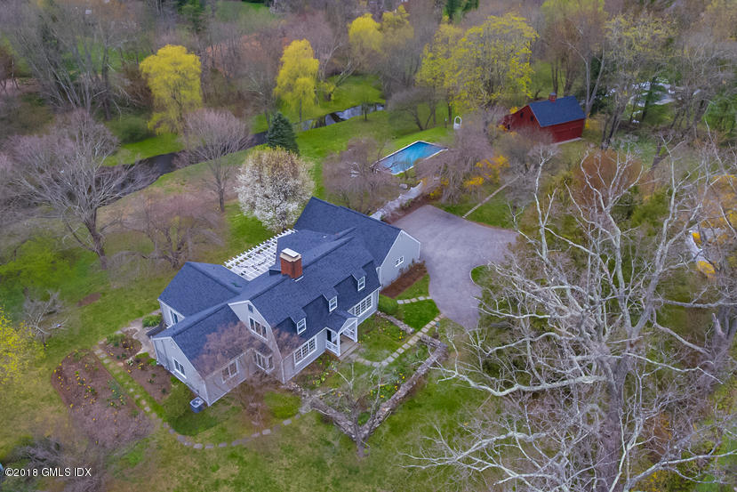 an aerial view of a house with a garden