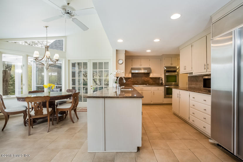 194 Bedford Road Greenwich, CT 06831 - Photo 11 of 44 a kitchen with stainless steel appliances kitchen island granite countertop a refrigerator and cabinets