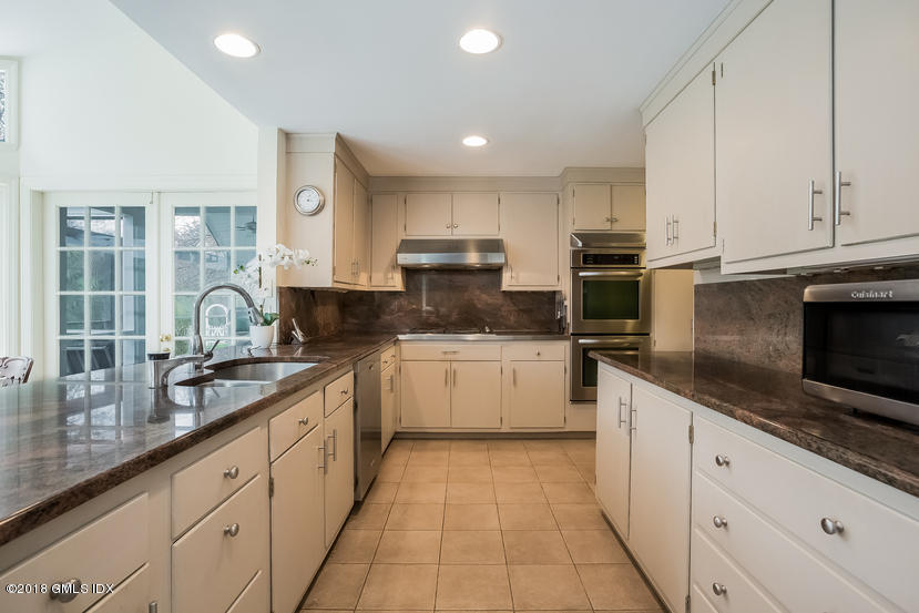 194 Bedford Road Greenwich, CT 06831 - Photo 12 of 44 a large kitchen with stainless steel appliances granite countertop a sink and cabinets