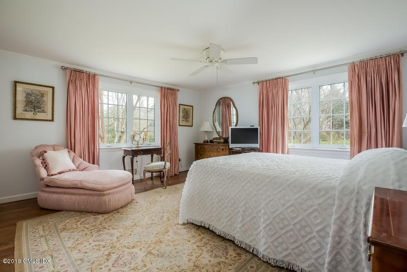 194 Bedford Road Greenwich, CT 06831 - Photo 17 of 44 a bedroom with a bed and a couch