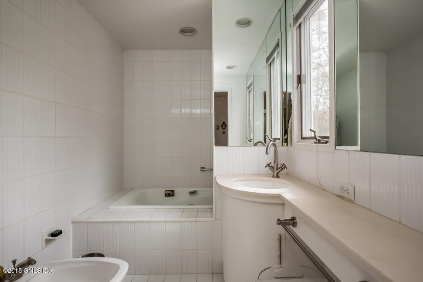 194 Bedford Road Greenwich, CT 06831 - Photo 18 of 44 a bathroom with a sink a toilet and shower
