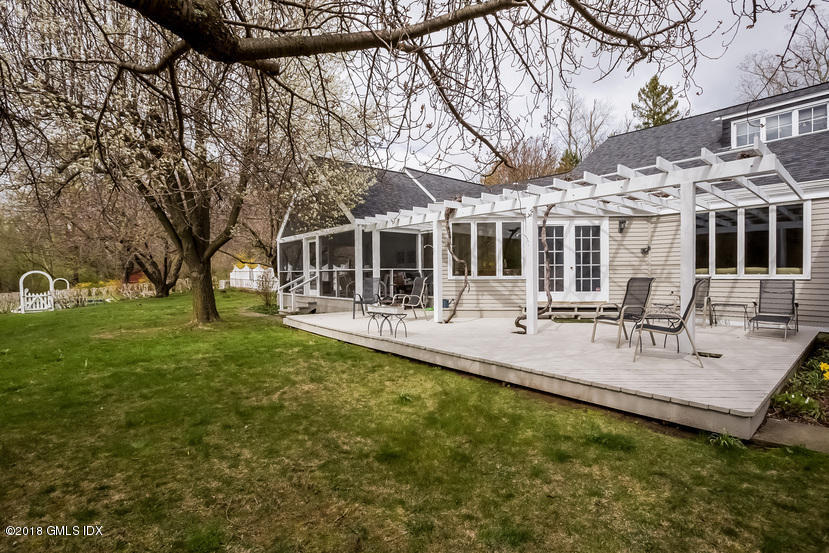 194 Bedford Road Greenwich, CT 06831 - Photo 24 of 44 a view of a building with a backyard patio and sitting area