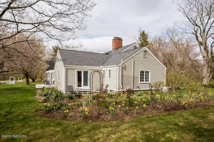 194 Bedford Road Greenwich, CT 06831 - Photo 25 of 44 a front view of house with a garden