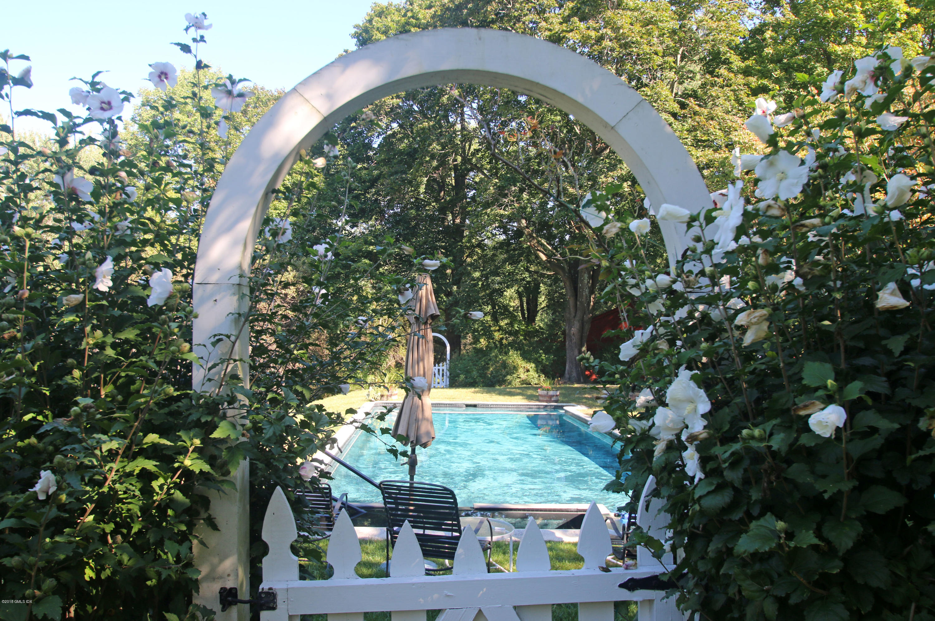 194 Bedford Road Greenwich, CT 06831 - Photo 26 of 44 an outdoor space with lots of trees