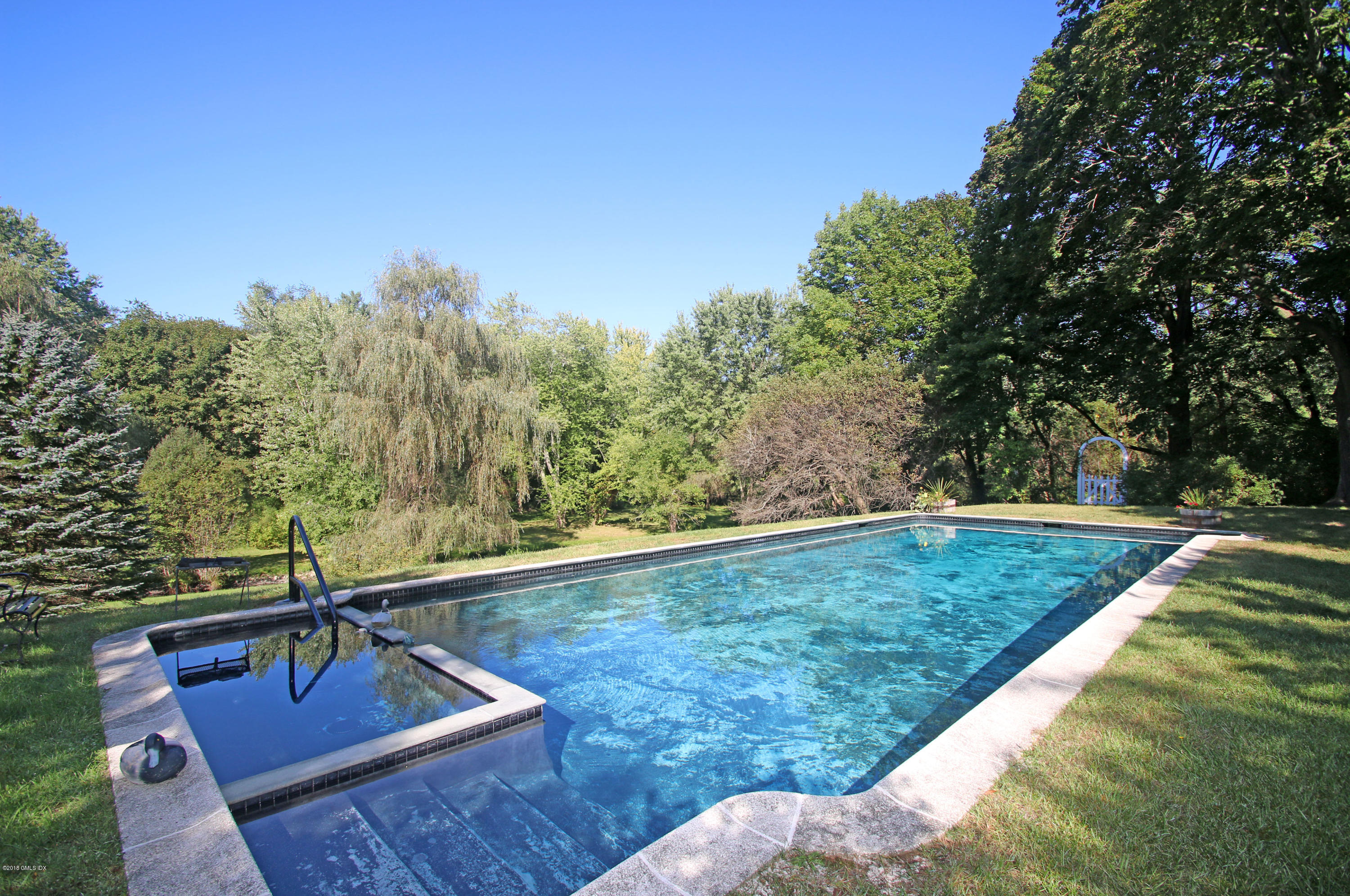 194 Bedford Road Greenwich, CT 06831 - Photo 27 of 44 a view of a backyard with trees