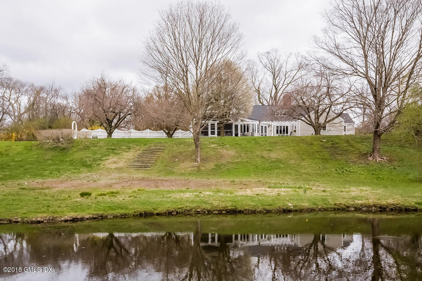 194 Bedford Road Greenwich, CT 06831 - Photo 29 of 44 a view of a lake with houses in the back