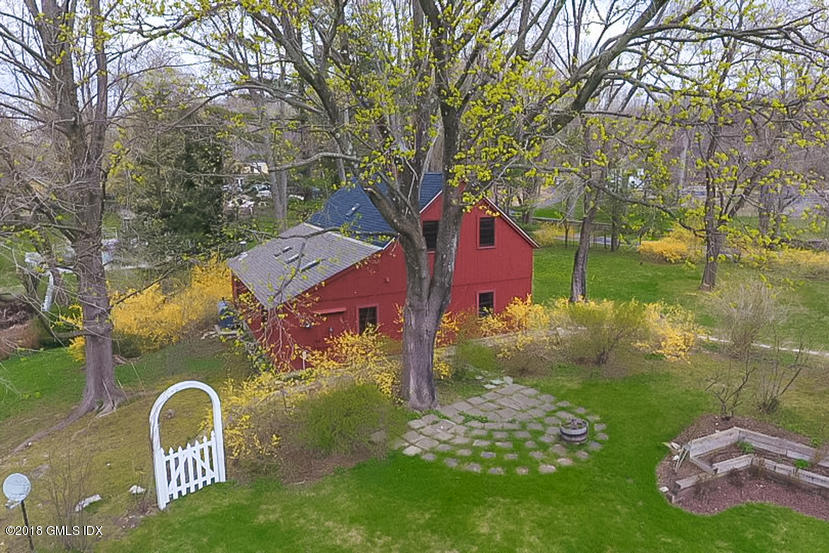194 Bedford Road Greenwich, CT 06831 - Photo 32 of 44 a backyard of a house with lots of green space