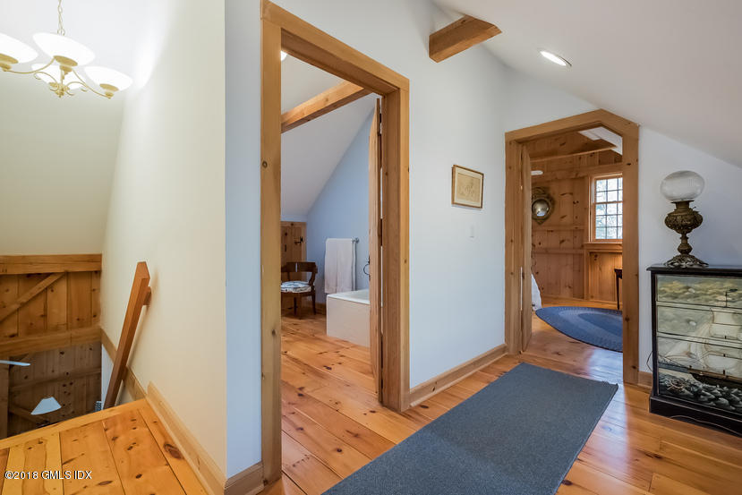 194 Bedford Road Greenwich, CT 06831 - Photo 39 of 44 a very nice looking room with a large mirror