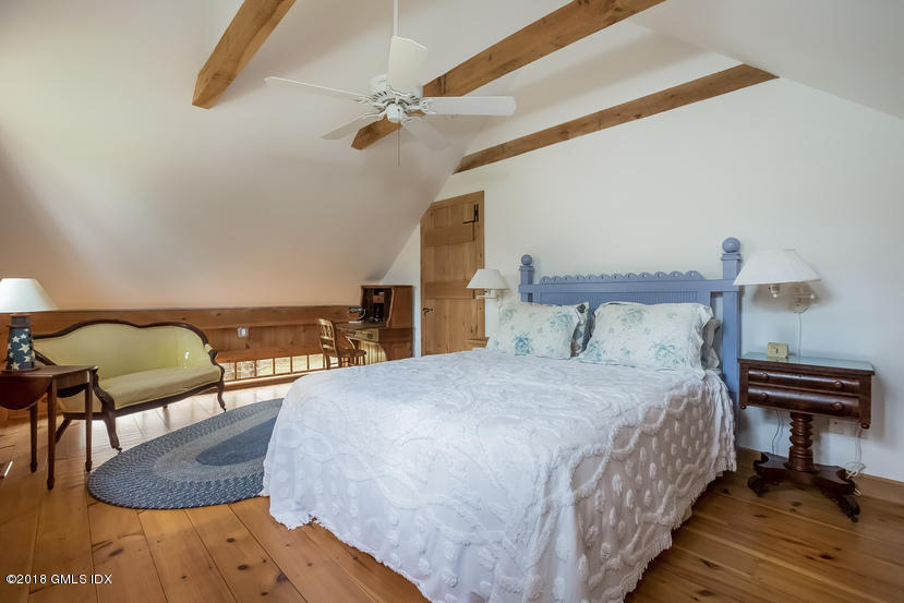 194 Bedford Road Greenwich, CT 06831 - Photo 44 of 44 a bedroom with a bed a dresser and chair