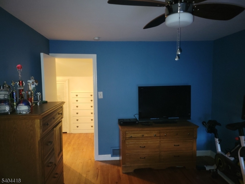 8 Randolph Avenue Hopatcong, NJ 07843 - Photo 16 of 30 a living room with furniture and a flat screen tv