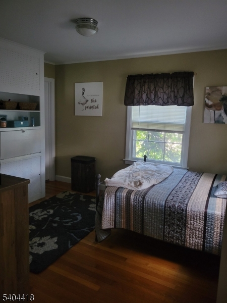 8 Randolph Avenue Hopatcong, NJ 07843 - Photo 20 of 30 a bedroom with a bed and a fireplace