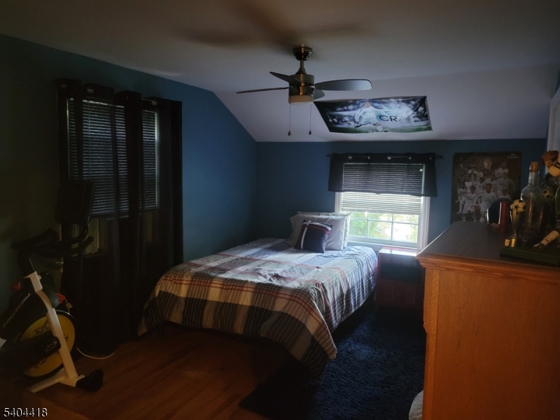 8 Randolph Avenue Hopatcong, NJ 07843 - Photo 24 of 30 a bedroom with a bed and a mirror