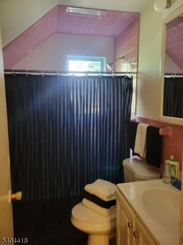 a view of small yard with wooden fence