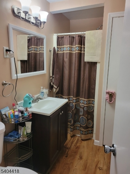 8 Randolph Avenue Hopatcong, NJ 07843 - Photo 7 of 30 a bathroom with a sink and a mirror