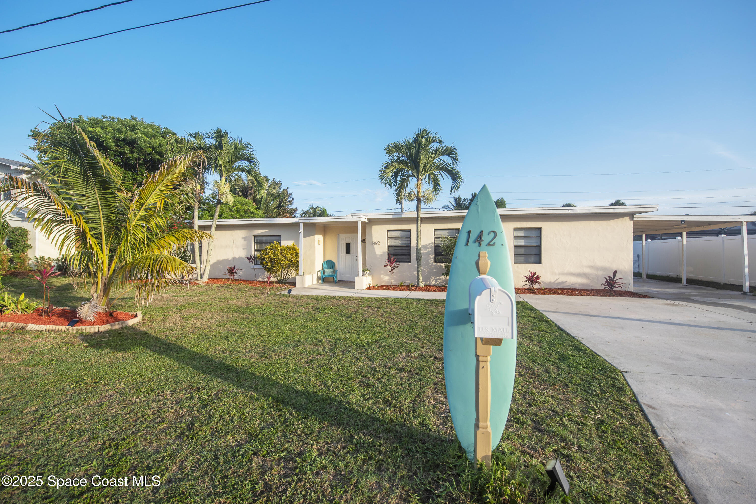 142 Atlantic Avenue Indialantic, FL 32903 - Photo 1 of 28 front view of a house with a yard