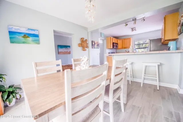 a view of kitchen with furniture and wooden floor