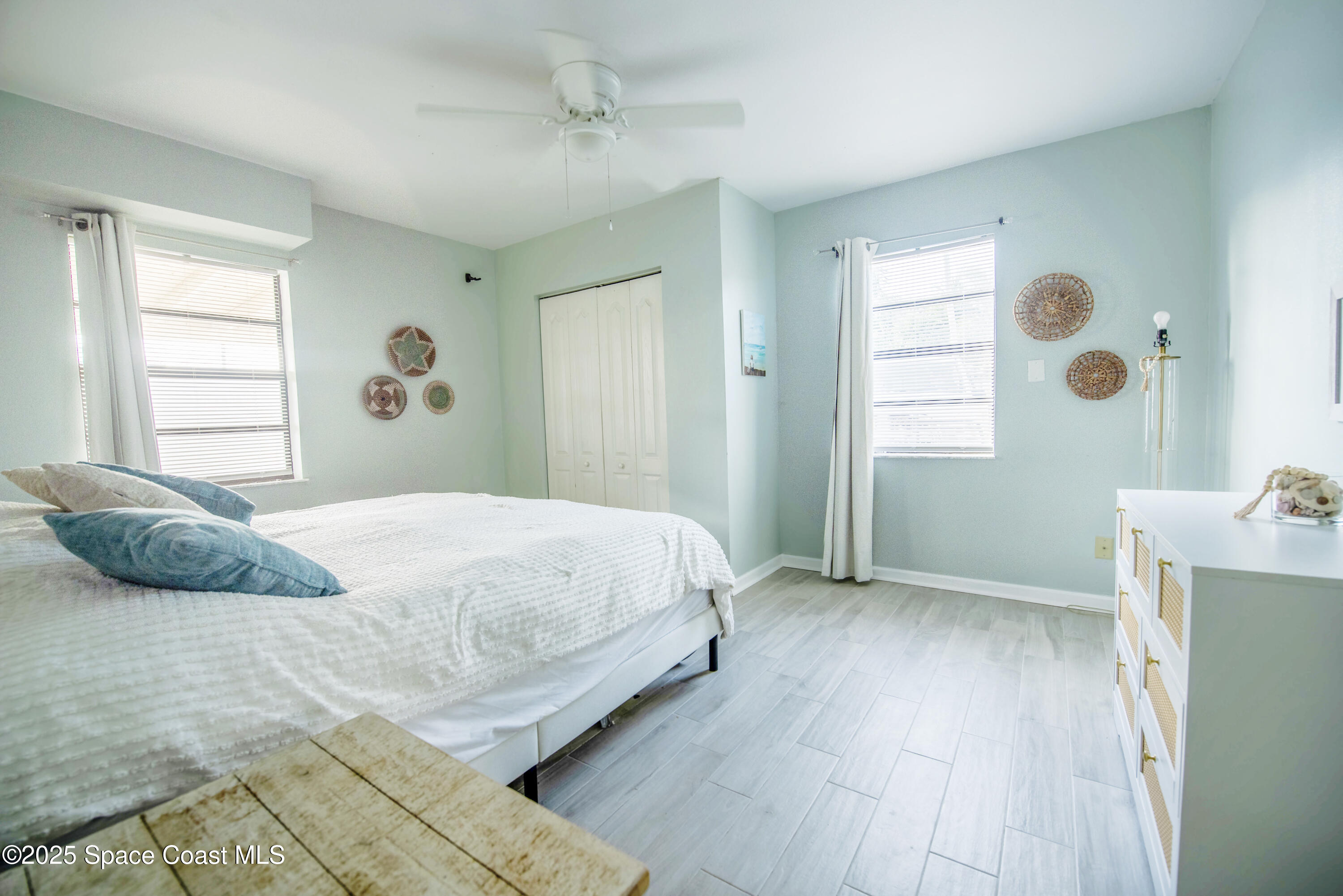 142 Atlantic Avenue Indialantic, FL 32903 - Photo 16 of 28 a bedroom with a bed and a window