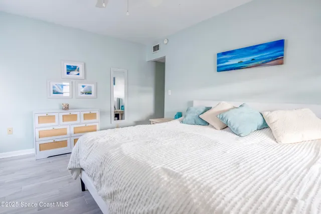 a bedroom with a bed and a cabinets