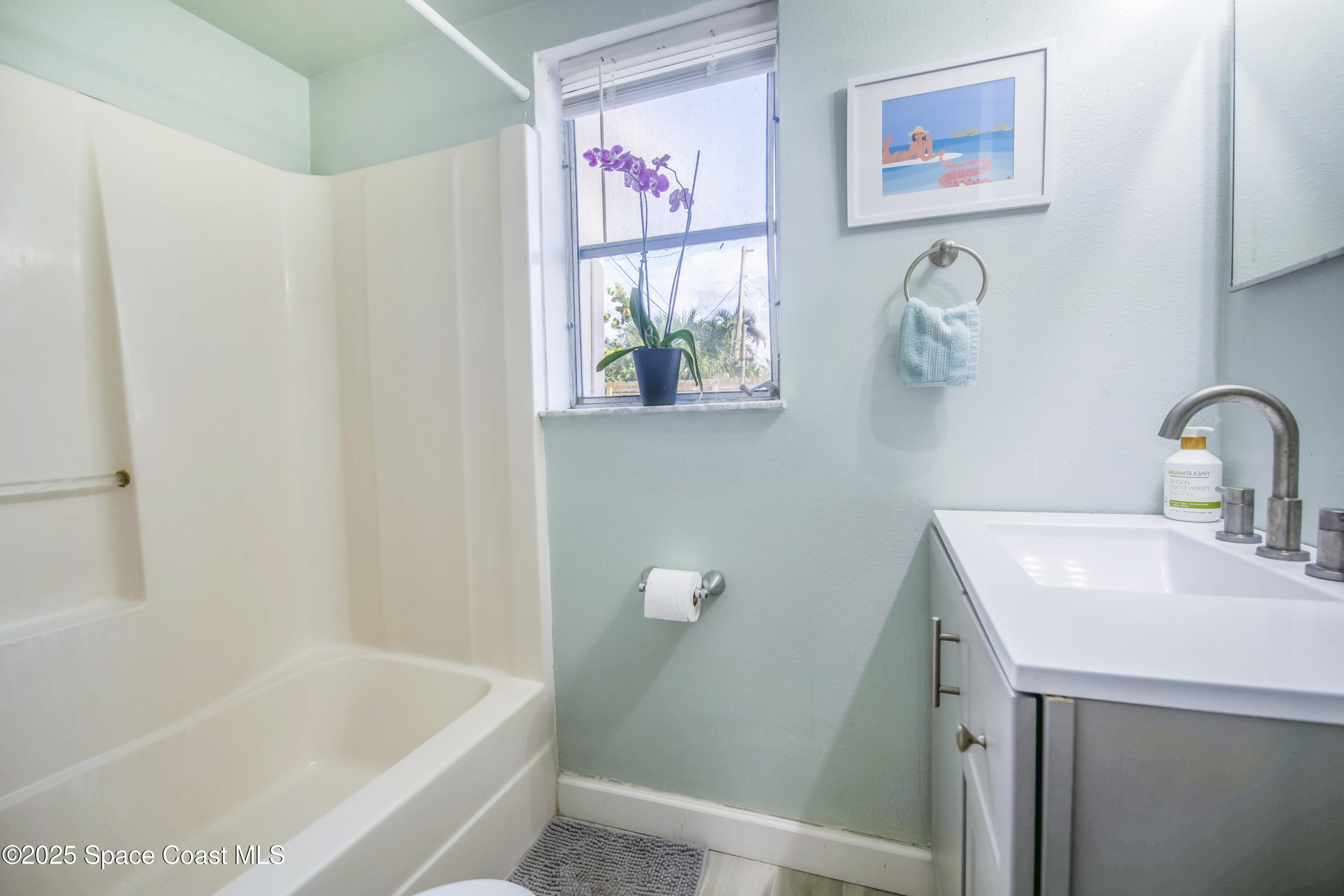 142 Atlantic Avenue Indialantic, FL 32903 - Photo 19 of 28 a bathroom with a sink and a bathtub