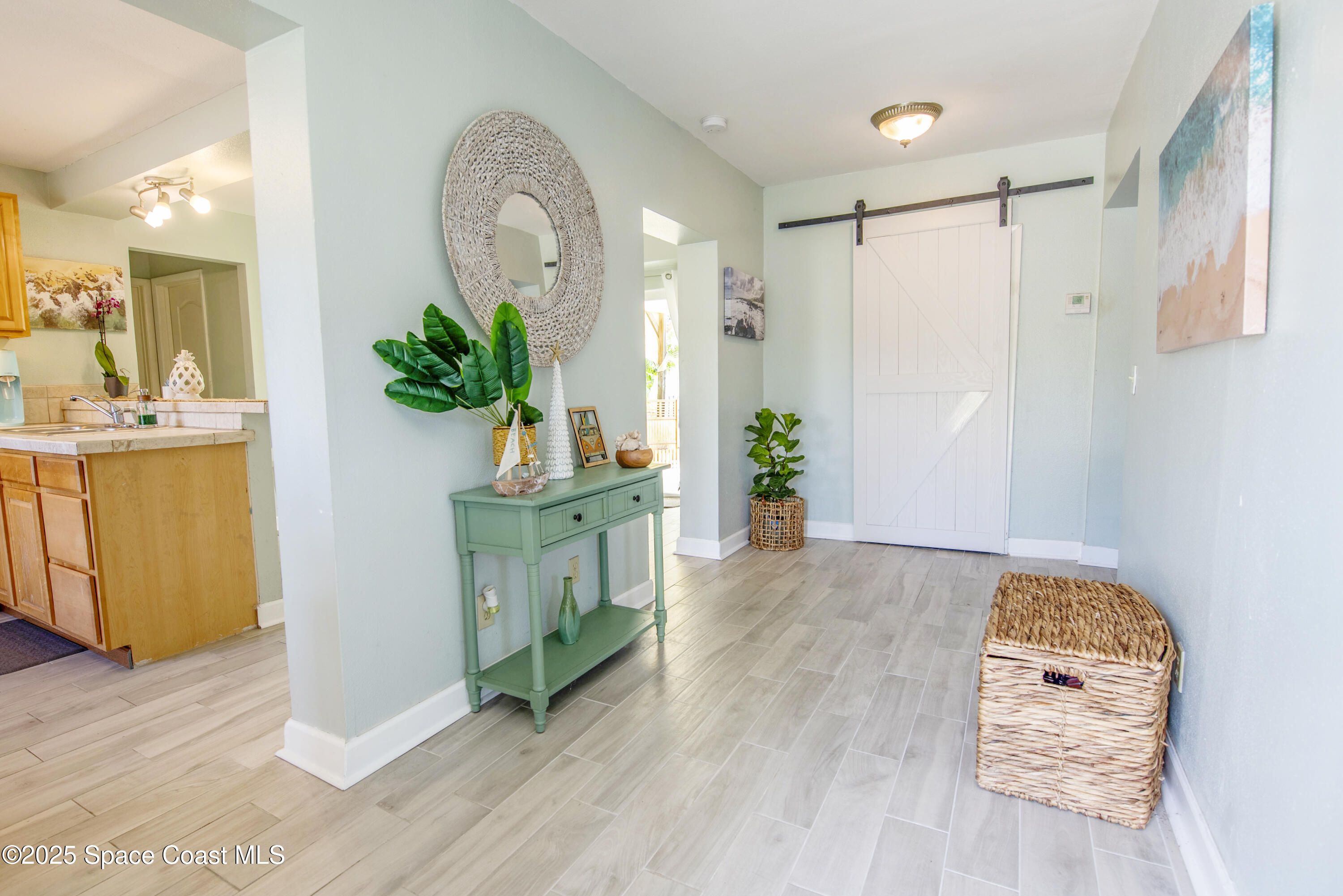 142 Atlantic Avenue Indialantic, FL 32903 - Photo 4 of 28 a view of kitchen with furniture and a wooden floor