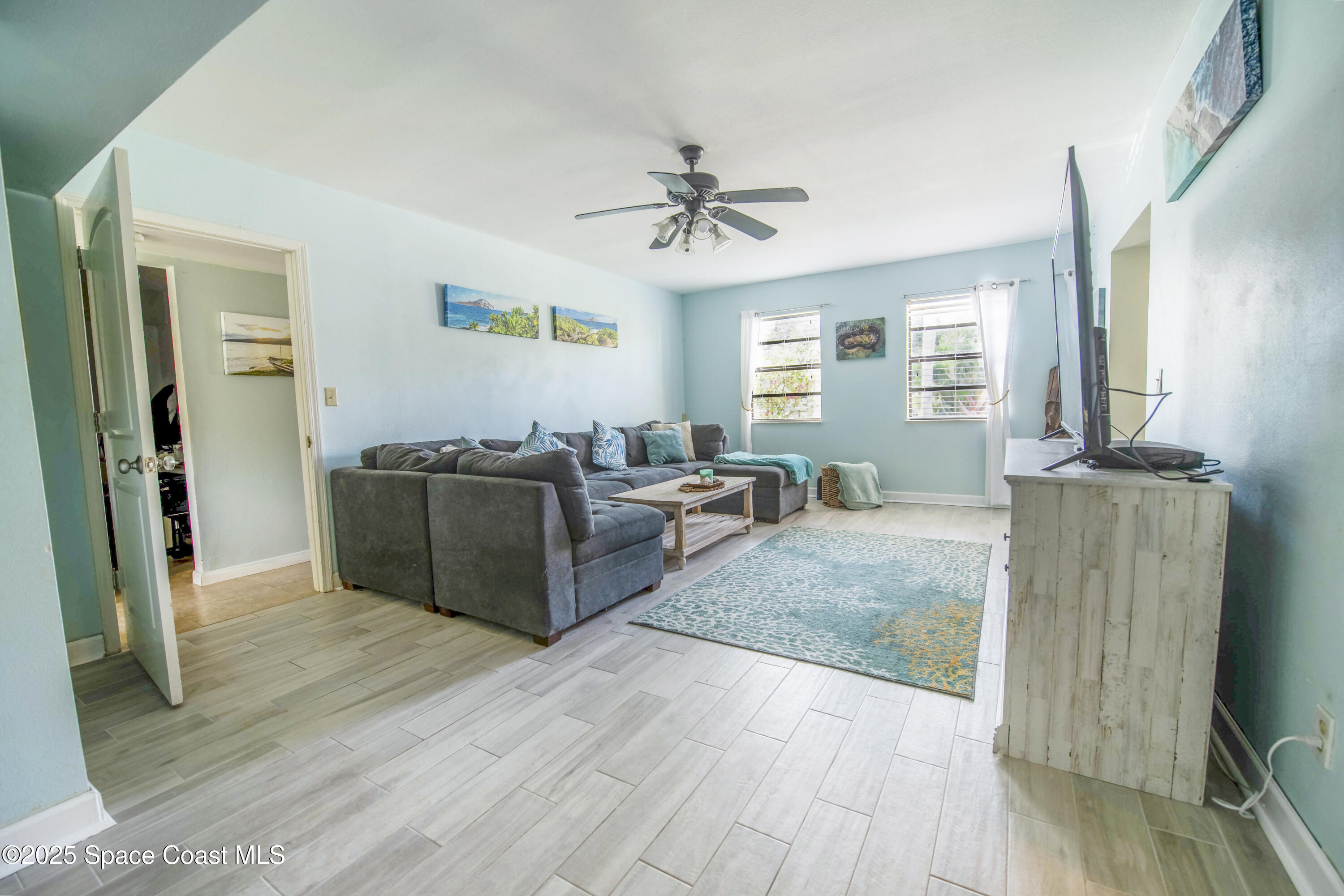 142 Atlantic Avenue Indialantic, FL 32903 - Photo 6 of 28 a living room with furniture window and wooden floor