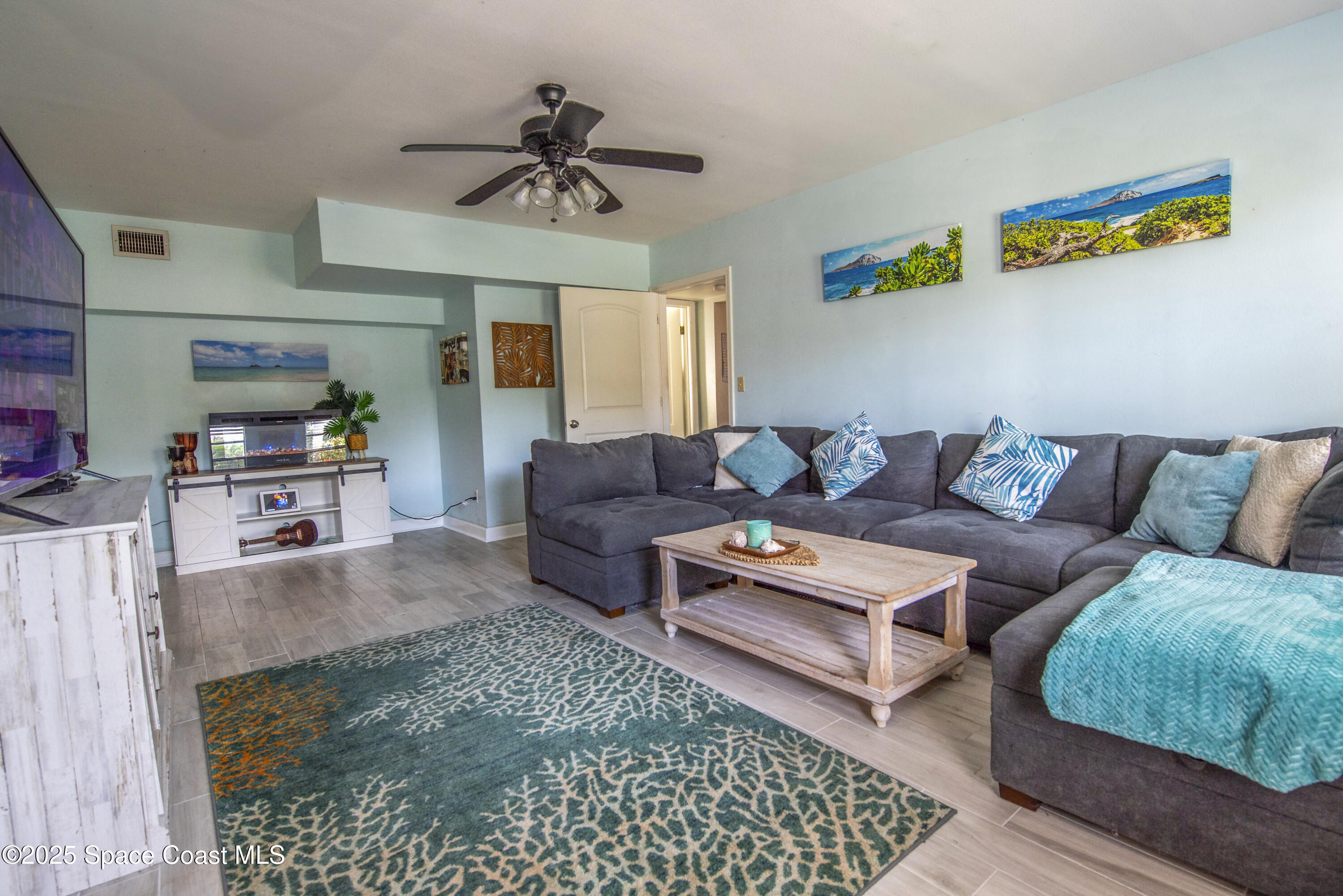142 Atlantic Avenue Indialantic, FL 32903 - Photo 8 of 28 a living room with furniture and a rug